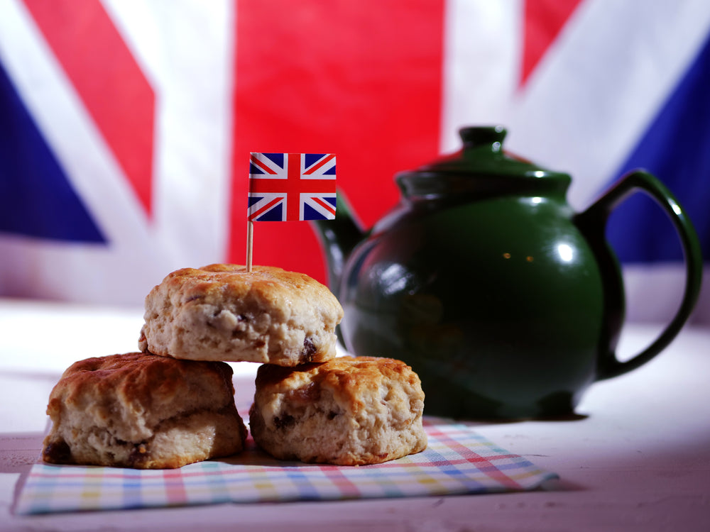 dark green teapot with biscuits