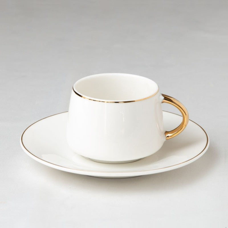 A set of twelve Vienna cabinet cups and saucers decorated with Rococo A set of twelve Vienna cabinet cups and saucers decorated with Rococo